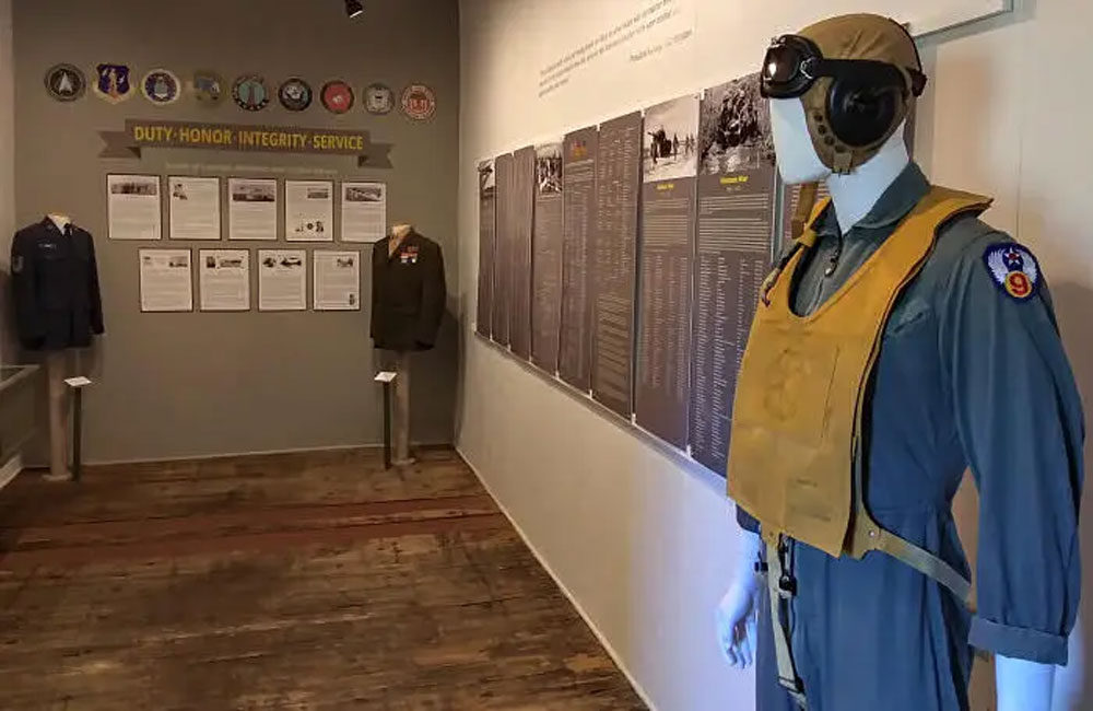 exhibit for military veterans with photos and mannequins with old clothing