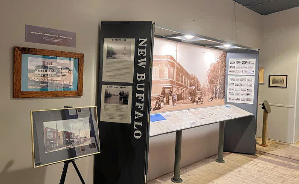 museum exhibit showing the history of new buffalo michigan with photos and text