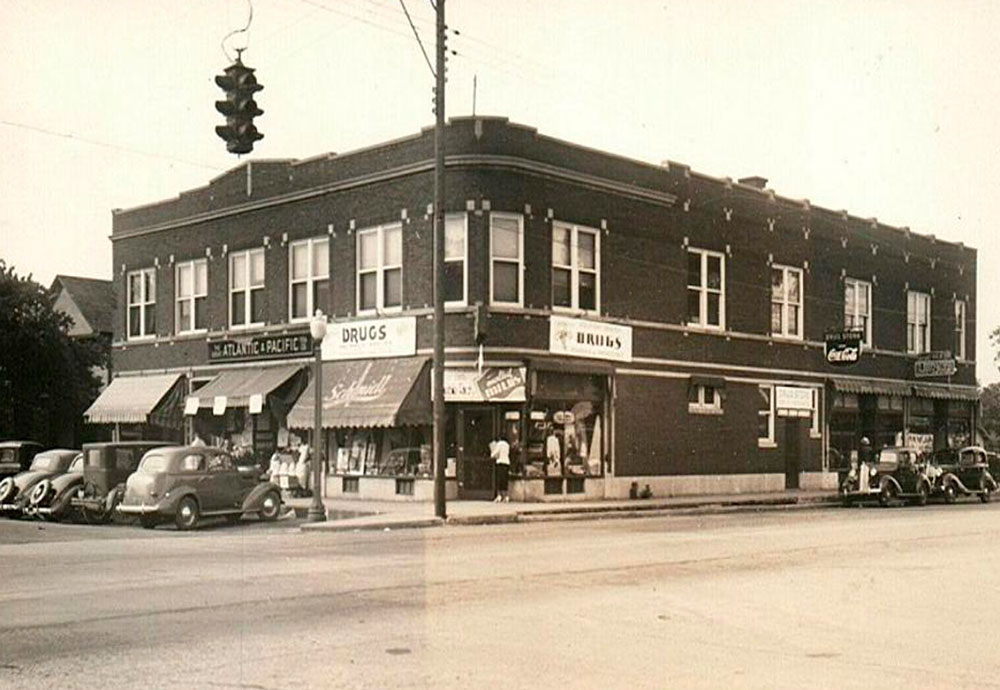 antique photo of a downtown brick drug store building